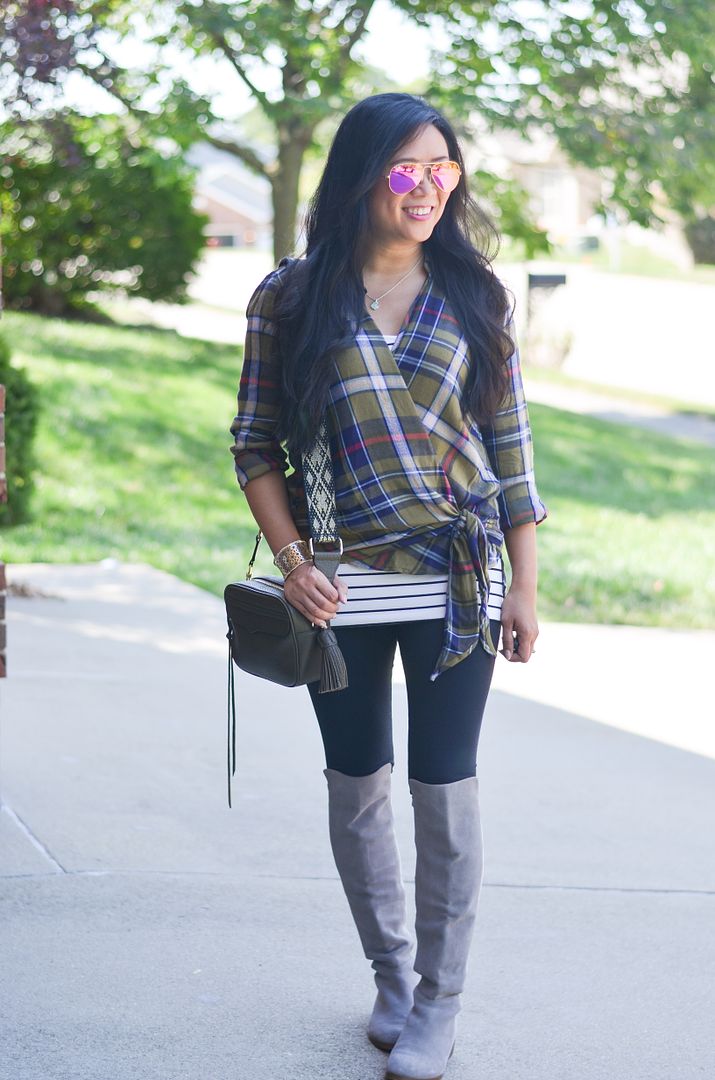 Plaid wrap top over stripe tunic and neutral OTK boots outfit