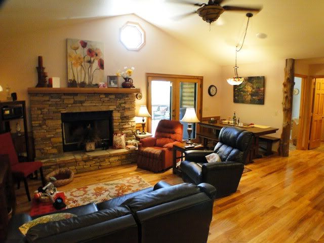 Rich hardwood floors, vaulted ceiling and fireplace in the cheerful living room, Franklin NC Homes for Sale, Franklin NC Log Home